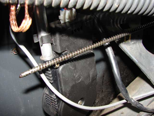 Push the cable backwards until the teeth are exposed and carefully 